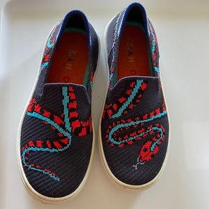 Rothy’s kids size 13 snake shoes.